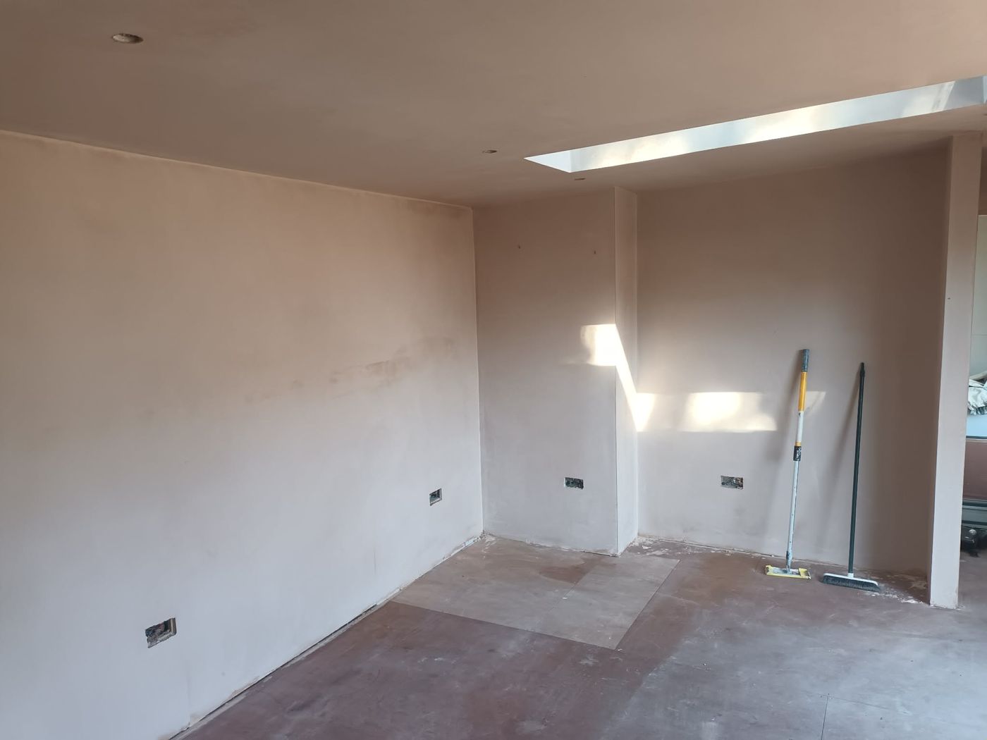 Bare plastered interior walls before spraying